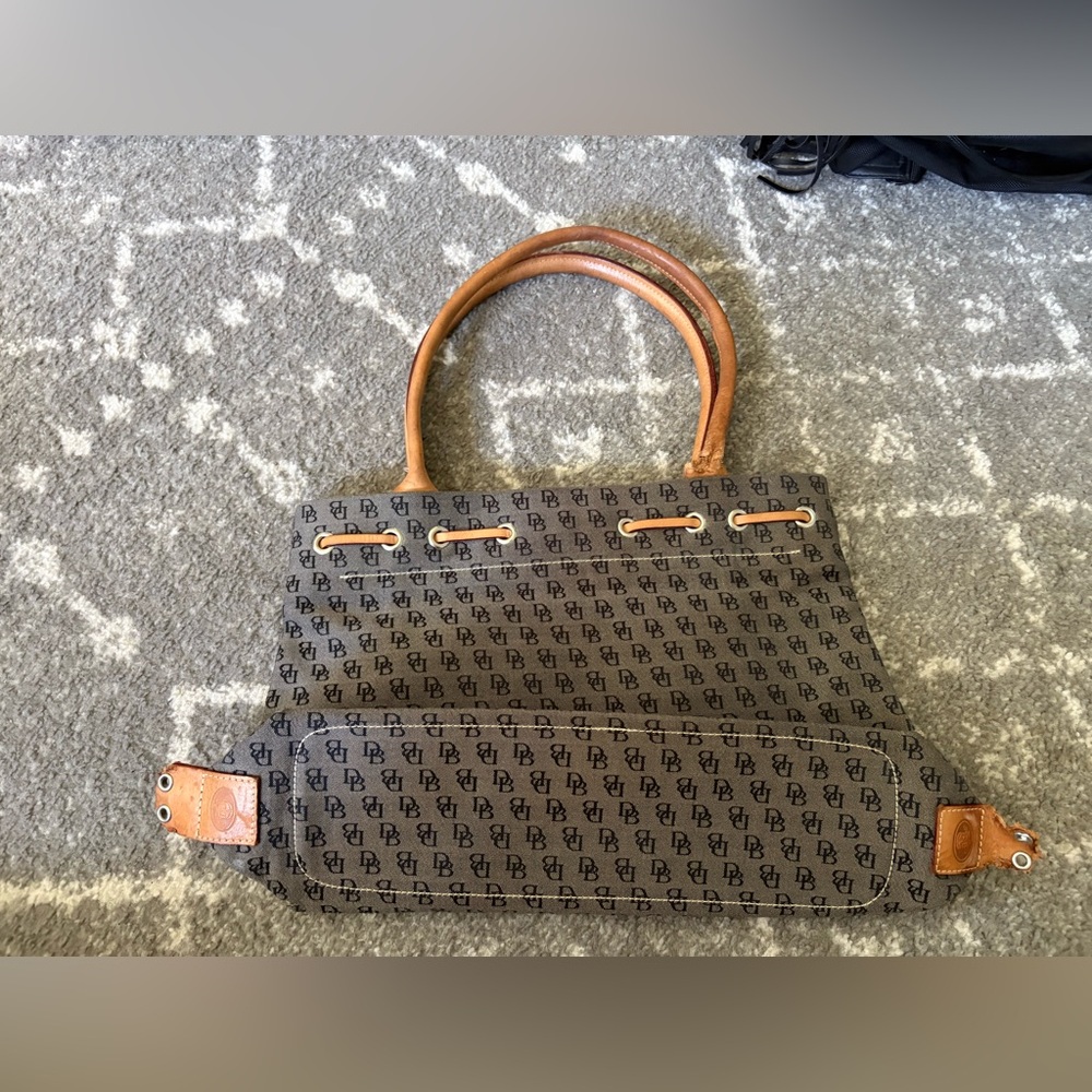 Dooney & Bourke, Inc bag. 
Needs a lot of love
